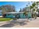 Charming home with a metal roof, delightful landscaping, and a welcoming front entrance at 2010 Bayview Pl, Indian Rocks Beach, FL 33785