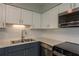 Updated kitchen features stainless steel appliances, updated countertops and modern cabinetry at 2010 Bayview Pl, Indian Rocks Beach, FL 33785