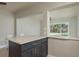 Kitchen island with counter seating and backyard view at 2010 Bayview Pl, Indian Rocks Beach, FL 33785