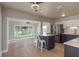 Stylish kitchen with stainless steel appliances, counter seating, and bright, airy lighting at 2010 Bayview Pl, Indian Rocks Beach, FL 33785