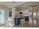 Open concept kitchen with counter seating, stainless appliances, and views into the living room at 2010 Bayview Pl, Indian Rocks Beach, FL 33785