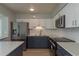 Modern kitchen featuring stainless steel appliances, stylish cabinetry, and ample counter space for meal preparation at 2010 Bayview Pl, Indian Rocks Beach, FL 33785