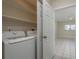 A dedicated laundry room offers a convenient space with new appliances and extra storage shelving at 2010 Bayview Pl, Indian Rocks Beach, FL 33785