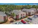 Aerial view of apartment buildings featuring parking and nice landscaping at 21032 Voyager Blvd # 8, Land O Lakes, FL 34638