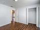 Freshly painted bedroom with walk-in closet and wood-look flooring at 21032 Voyager Blvd # 8, Land O Lakes, FL 34638