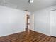 Neutral bedroom with wood-look flooring, and access to the ensuite bathroom at 21032 Voyager Blvd # 8, Land O Lakes, FL 34638