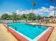 A clear, blue swimming pool with plenty of space for activities at 21032 Voyager Blvd # 8, Land O Lakes, FL 34638