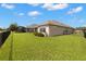 Home backyard with fence and view of home's architecture at 2350 126Th E Dr, Parrish, FL 34219
