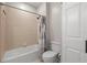 Neutral bathroom featuring tiled walls and a shower-tub combination at 2350 126Th E Dr, Parrish, FL 34219