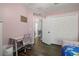 Bedroom featuring wood floors, a desk, and a closet at 2350 126Th E Dr, Parrish, FL 34219