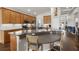 Updated kitchen with stainless steel appliances, oak cabinets, granite countertops, an island, and breakfast bar at 2350 126Th E Dr, Parrish, FL 34219