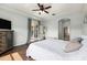 Bright main bedroom with backyard views, tray ceiling, and en-suite bathroom at 2350 126Th E Dr, Parrish, FL 34219
