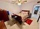 Bedroom with a ceiling fan, dresser, nightstand, and a cozy atmosphere at 2434 Australia E Way # 38, Clearwater, FL 33763