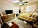 Comfortable bedroom with dresser, ceiling fan, and a relaxing atmosphere at 2434 Australia E Way # 38, Clearwater, FL 33763