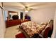 Comfortable bedroom with ceiling fan, dresser, and a warm, inviting atmosphere at 2434 Australia E Way # 38, Clearwater, FL 33763