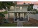 Cozy backyard patio with outdoor seating, hanging chair, and white pergola, perfect for relaxation and entertaining at 2616 11Th N St, St Petersburg, FL 33704