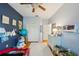 This comfortable ' bedroom features wood floors and is decorated with blue accent walls at 2616 11Th N St, St Petersburg, FL 33704