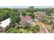 Charming two-story home with a red tile roof, surrounded by tropical landscaping, including lush palm trees at 2616 11Th N St, St Petersburg, FL 33704