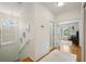 Bright hallway with natural light, a chandelier, and hardwood floors at 2616 11Th N St, St Petersburg, FL 33704