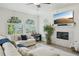 Cozy living room boasts a fireplace, large windows, and stylish furnishings at 2616 11Th N St, St Petersburg, FL 33704