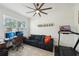 Home office/flex space featuring a ceiling fan, desk area and sitting area with a small exercise space at 2616 11Th N St, St Petersburg, FL 33704