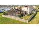 Aerial view of a backyard with a pool, patio, and lush landscaping at 3091 King Fern Dr, Wimauma, FL 33598
