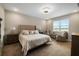 Serene bedroom with a large window, plush carpeting, and neutral decor, creating a peaceful and inviting atmosphere at 3091 King Fern Dr, Wimauma, FL 33598