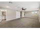 Expansive carpeted bonus room with natural light, en suite bathroom, and multiple closets at 3091 King Fern Dr, Wimauma, FL 33598