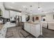 Modern kitchen with stainless steel appliances, granite countertops, and an island with bar seating at 3091 King Fern Dr, Wimauma, FL 33598