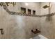 Elegant tiled shower with built-in niches, a shower bench, and a rainfall shower head at 3091 King Fern Dr, Wimauma, FL 33598
