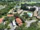 Aerial view of the community, showcasing the lush landscaping, pools, and surrounding lakes at 311 Knottwood Ct, Sun City Center, FL 33573