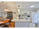 Spacious kitchen with a breakfast bar, white cabinetry, and stainless steel appliances at 311 Knottwood Ct, Sun City Center, FL 33573