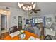 Cozy living area with a dining table, comfortable seating, and access to the screened patio at 311 Knottwood Ct, Sun City Center, FL 33573