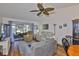 Bright living room with sliding glass doors, hardwood floors, and comfortable seating at 311 Knottwood Ct, Sun City Center, FL 33573