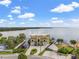 Stunning aerial view of a luxurious waterfront home with a private dock and beautiful landscaping at 3236 Gulf Winds Cir, Hernando Beach, FL 34607