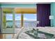 Balcony offering panoramic water views and an ornate wrought iron railing and brick pavers at 3236 Gulf Winds Cir, Hernando Beach, FL 34607