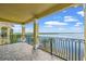 Waterfront balcony offering expansive water views and beautiful wrought iron railing at 3236 Gulf Winds Cir, Hernando Beach, FL 34607