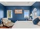 Inviting bedroom with scenic views from multiple windows and a cozy sitting area for relaxation at 3236 Gulf Winds Cir, Hernando Beach, FL 34607
