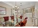 Dining room featuring a glass-top table, plush chairs, and decorative columns throughout the space at 3236 Gulf Winds Cir, Hernando Beach, FL 34607