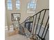 Spacious foyer with high ceilings, wrought iron staircase, and large windows for plenty of natural light at 3236 Gulf Winds Cir, Hernando Beach, FL 34607