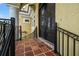 Close-up of the ornate front entrance featuring a decorative door, tiled porch, and elegant architectural details at 3236 Gulf Winds Cir, Hernando Beach, FL 34607