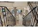 Living room as seen from the staircase, with a fireplace and water view at 3236 Gulf Winds Cir, Hernando Beach, FL 34607