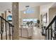 Elegant living room features high ceilings and large windows offering stunning views at 3236 Gulf Winds Cir, Hernando Beach, FL 34607