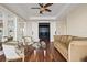 Bright living room with hardwood floors, stylish furniture, and French doors that lead to a media room at 3236 Gulf Winds Cir, Hernando Beach, FL 34607