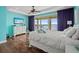 Comfortable bedroom with a TV, dresser, a ceiling fan, and balcony access with water views at 3236 Gulf Winds Cir, Hernando Beach, FL 34607