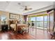 Spacious main bedroom with hardwood floors, large windows, and a scenic view of the water at 3236 Gulf Winds Cir, Hernando Beach, FL 34607