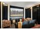 Home theater with comfortable seating, a large screen, and accent lighting for an immersive viewing experience at 3236 Gulf Winds Cir, Hernando Beach, FL 34607