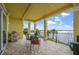 Covered patio with outdoor seating and stunning views of the water at 3236 Gulf Winds Cir, Hernando Beach, FL 34607