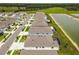 Aerial view of a beautiful community that features homes and lake at 33700 Hamilton Hill Ln, Wesley Chapel, FL 33545