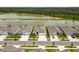Aerial view of the homes, manicured lawns, and the tranquil lake, creating a picturesque community at 33700 Hamilton Hill Ln, Wesley Chapel, FL 33545